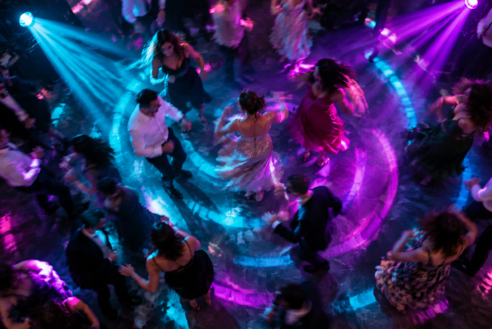 Dance floor seen from above under colorful event lighting