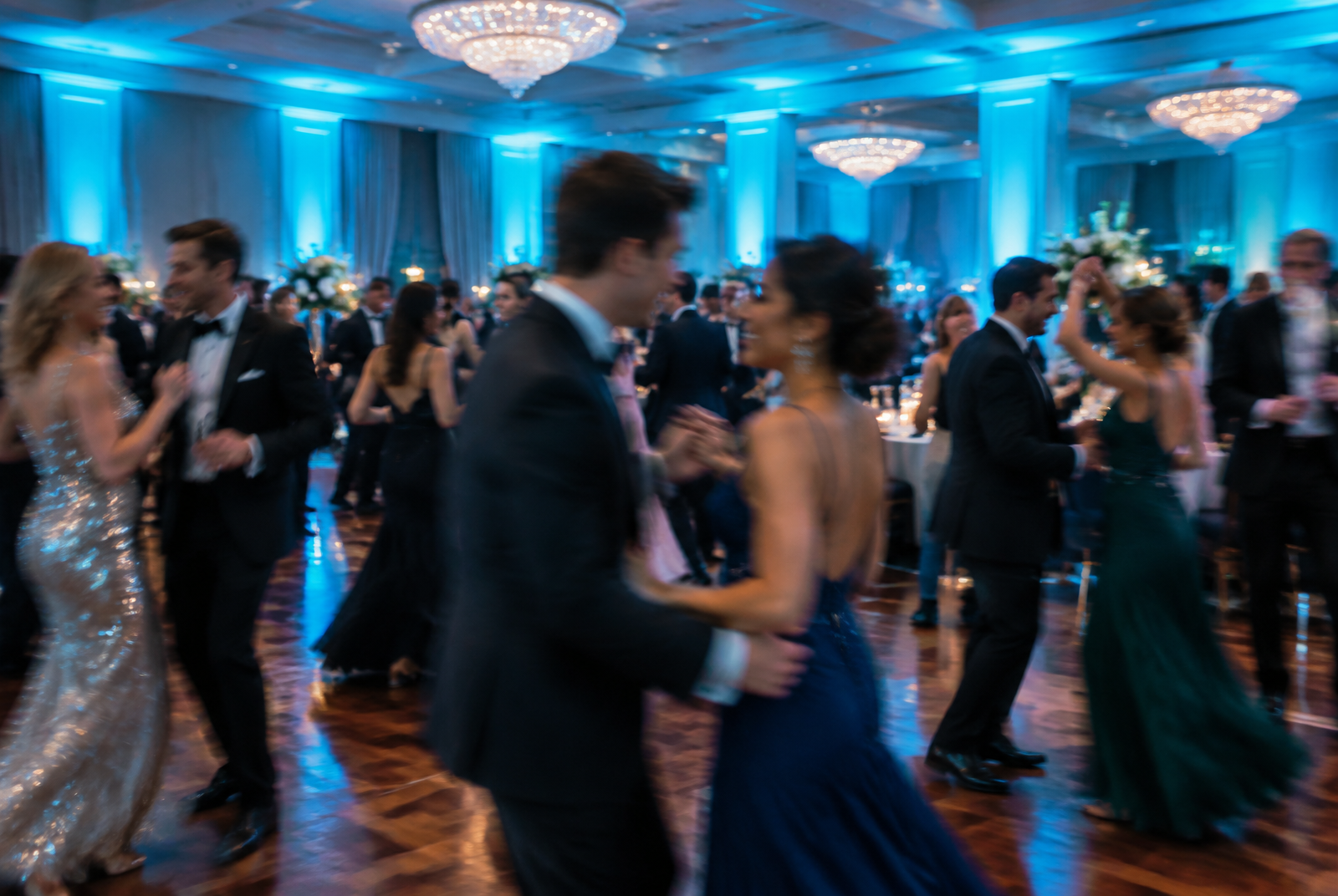 Corporate gala guests dancing in a ballroom